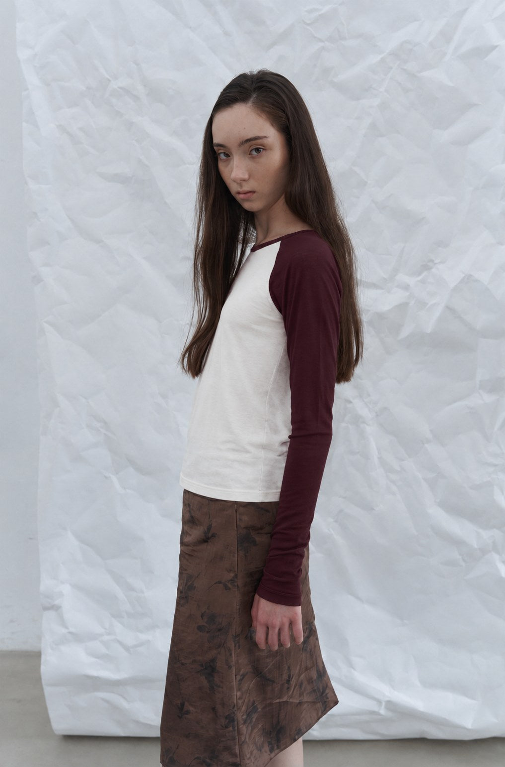 Contrast Raglan Tee — Burgundy sleeves, three-quarter view