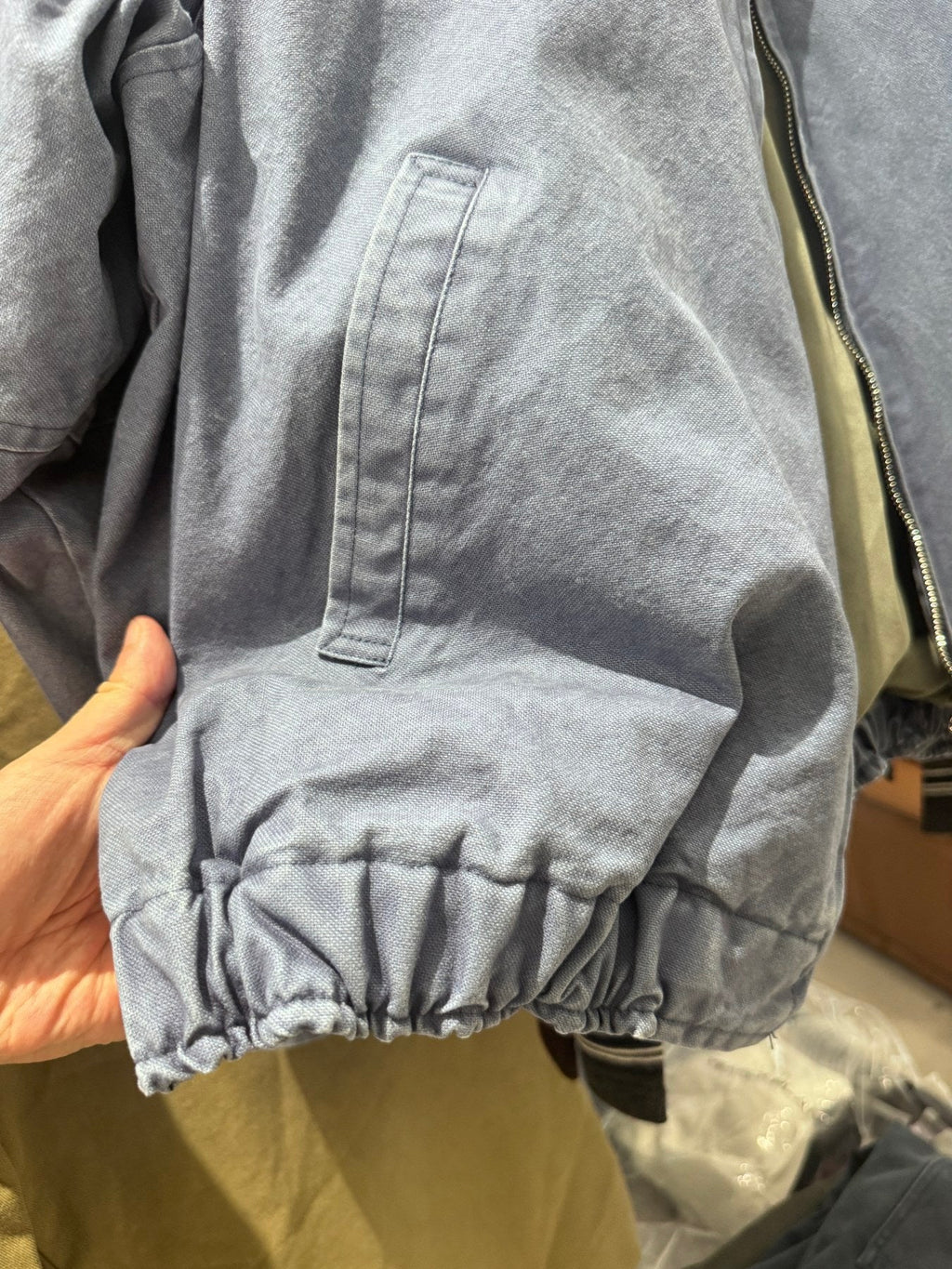 Washed Zip Jacket — Hem and pocket detail