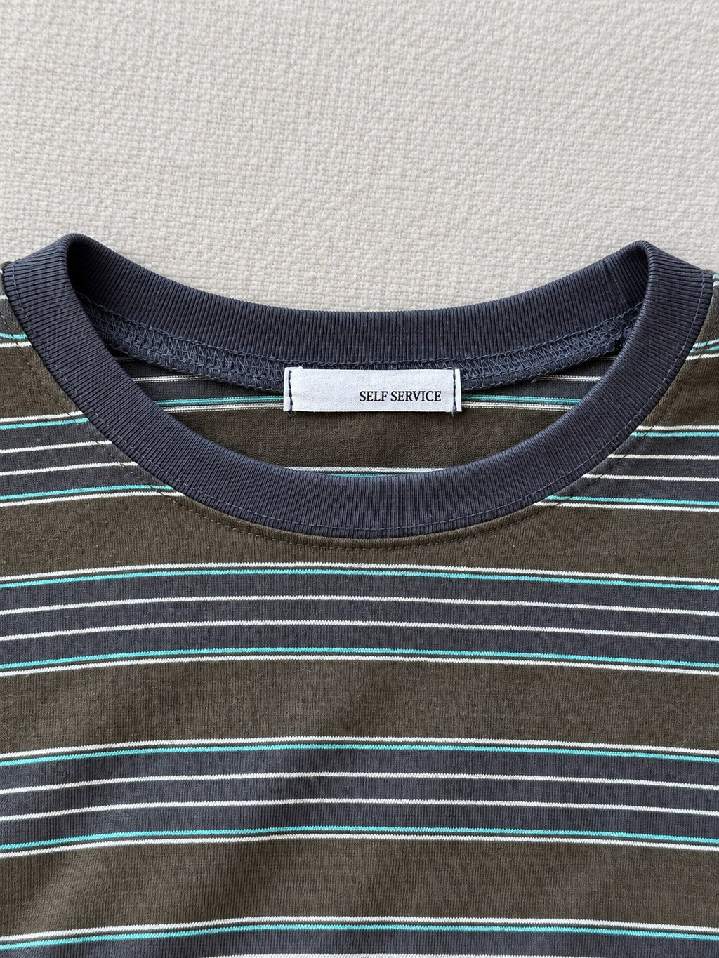 Striped Pocket Tee — Green stripe, neckline detail